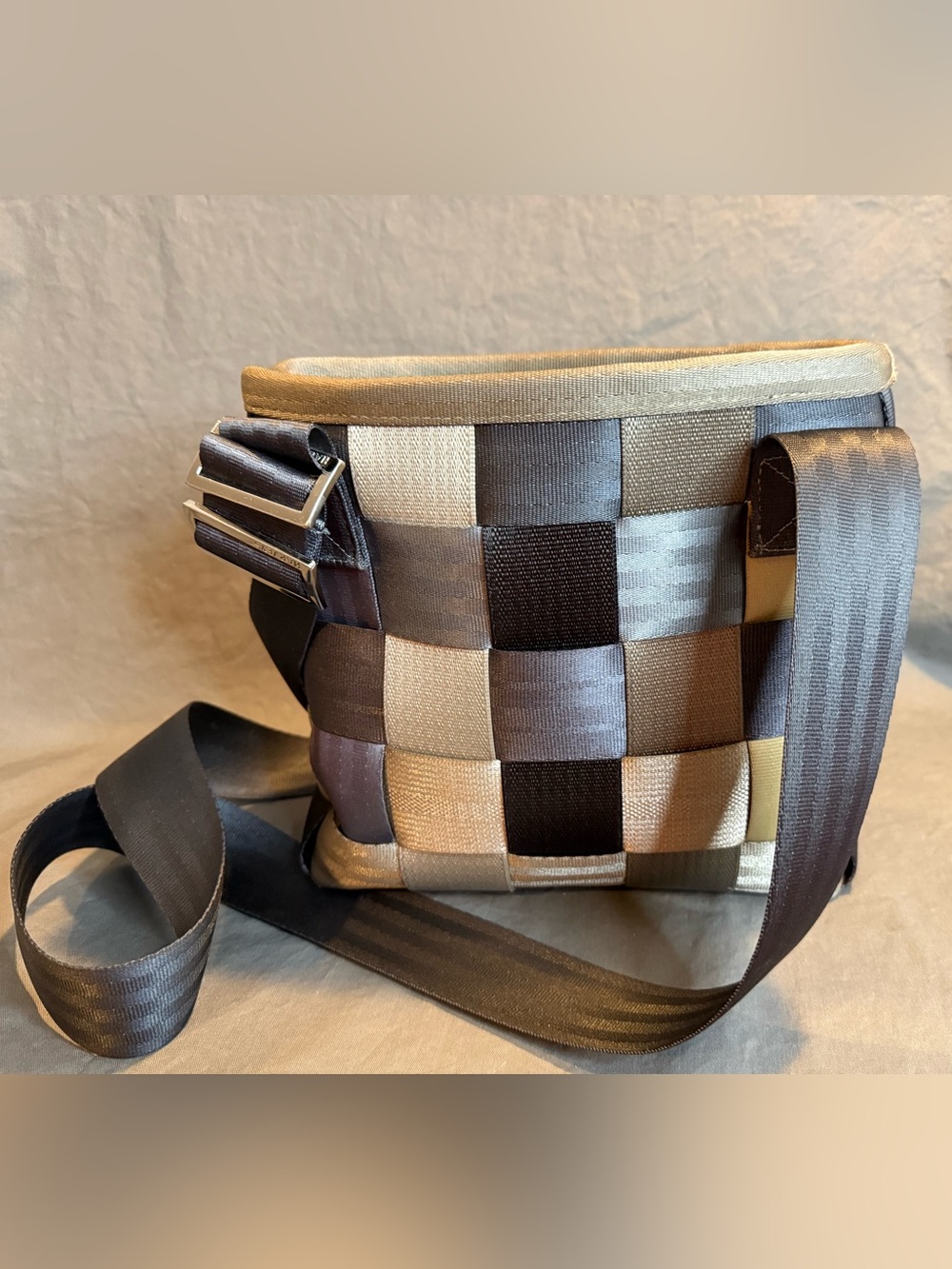 Harvey’s Woven Seatbelt Checkerboard Crossbody Bag in Grays, Browns and Cream